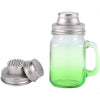 A clear glass mason jar with a metal spice lid and strainer, showing a vibrant green tint.