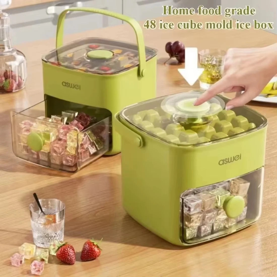 A yellow electric ice cube maker with two layers is shown on a wooden table, next to fresh fruit and ice cubes.