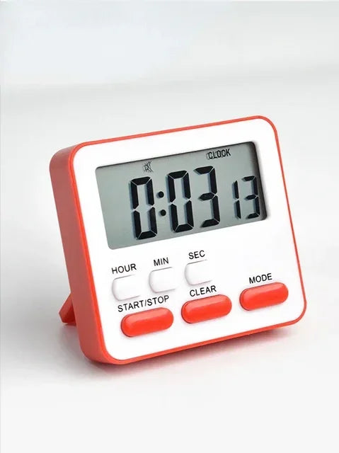 A red and white digital kitchen timer displaying 0:03:13 with function buttons.