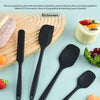 A set of six black silicone kitchen spatulas and tools displayed on a light blue background with food items.