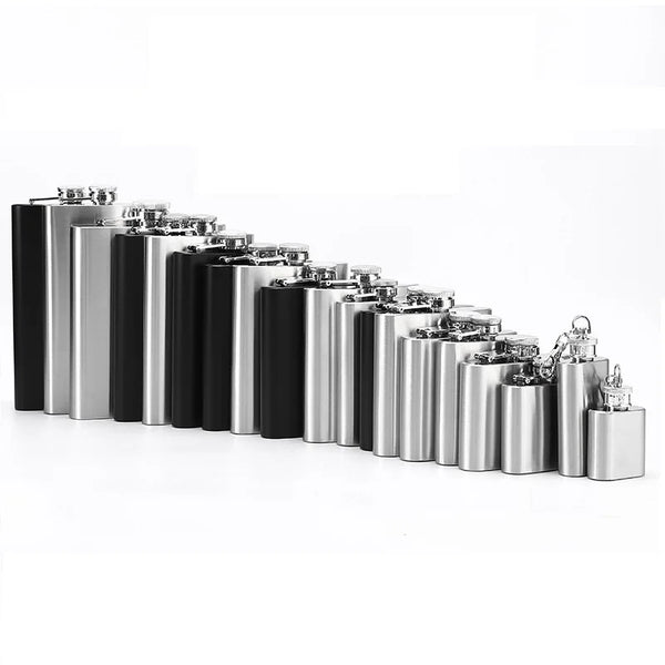 A row of portable stainless steel hip flasks in various finishes, displayed horizontally.