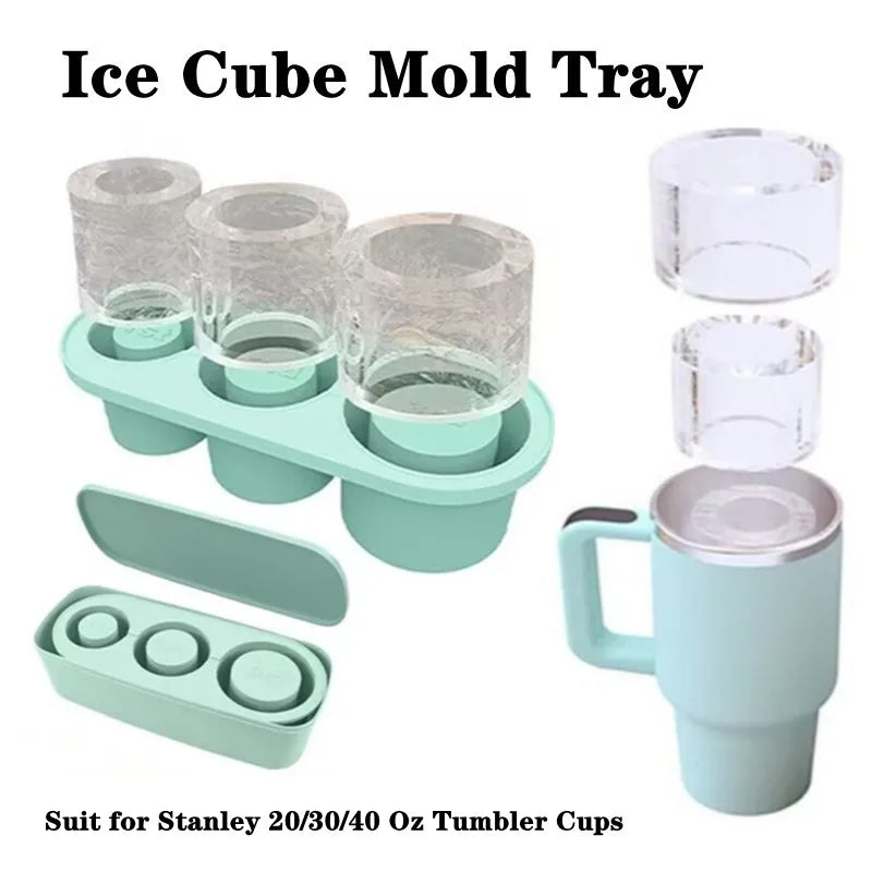 A set of silicone ice cube molds and a tumbler cup featuring a teal green color.