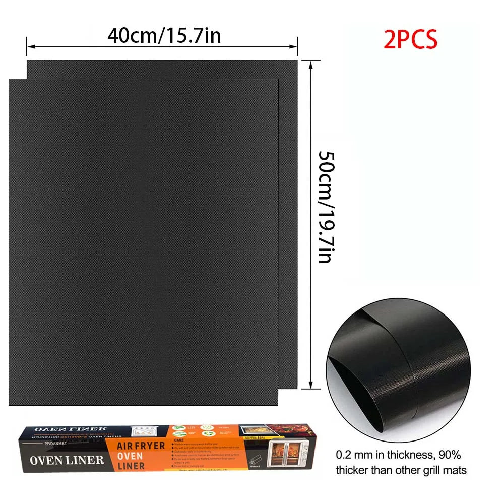 Two black oven liners or grill mats, 40cm long and 50cm wide, for baking.