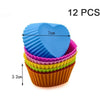 A set of 12 silicone muffin and cake baking molds in various colors, stacked together.