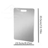 A rectangular stainless steel cutting board with a brushed finish shown in profile.