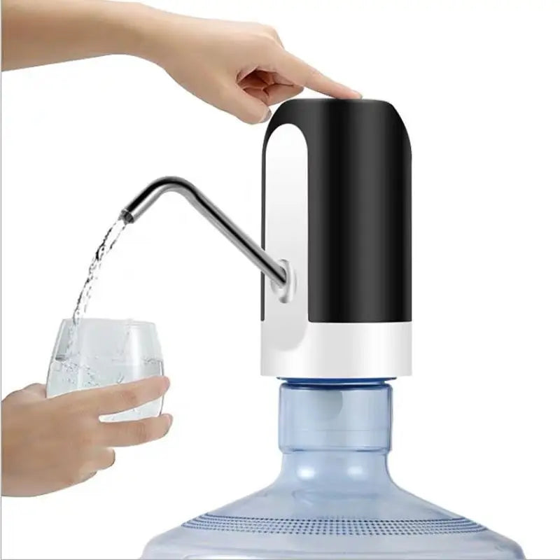 A hand is dispensing water from an automatic USB charging water dispenser pump into a glass.
