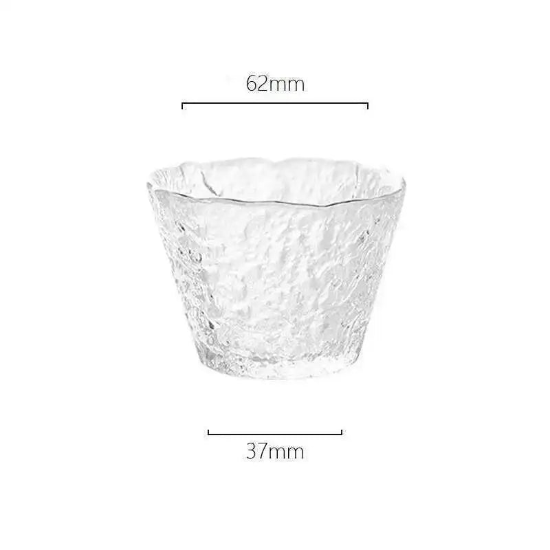 A clear, textured glass bowl with a slightly flared rim, shown against a white background.