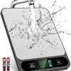 A precision digital kitchen scale is shown with water splashing onto the weighing platform.