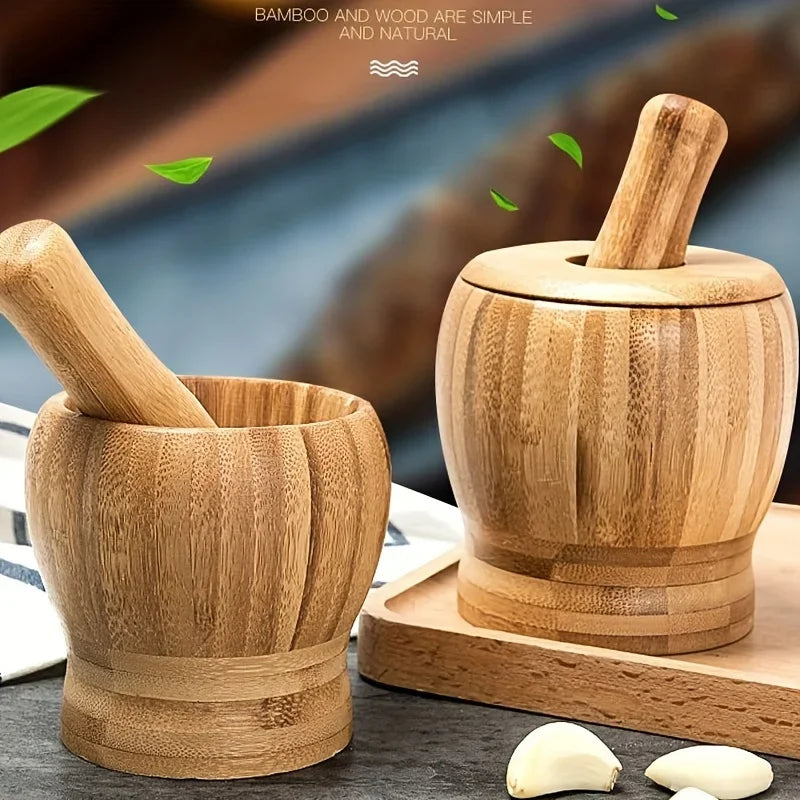 A set of natural bamboo mortar and pestle for grinding spices, shown on a wooden surface.