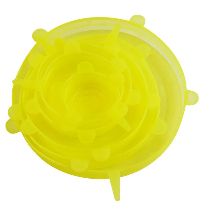 A yellow reusable silicone food lids set with multiple circular and pointed shapes.