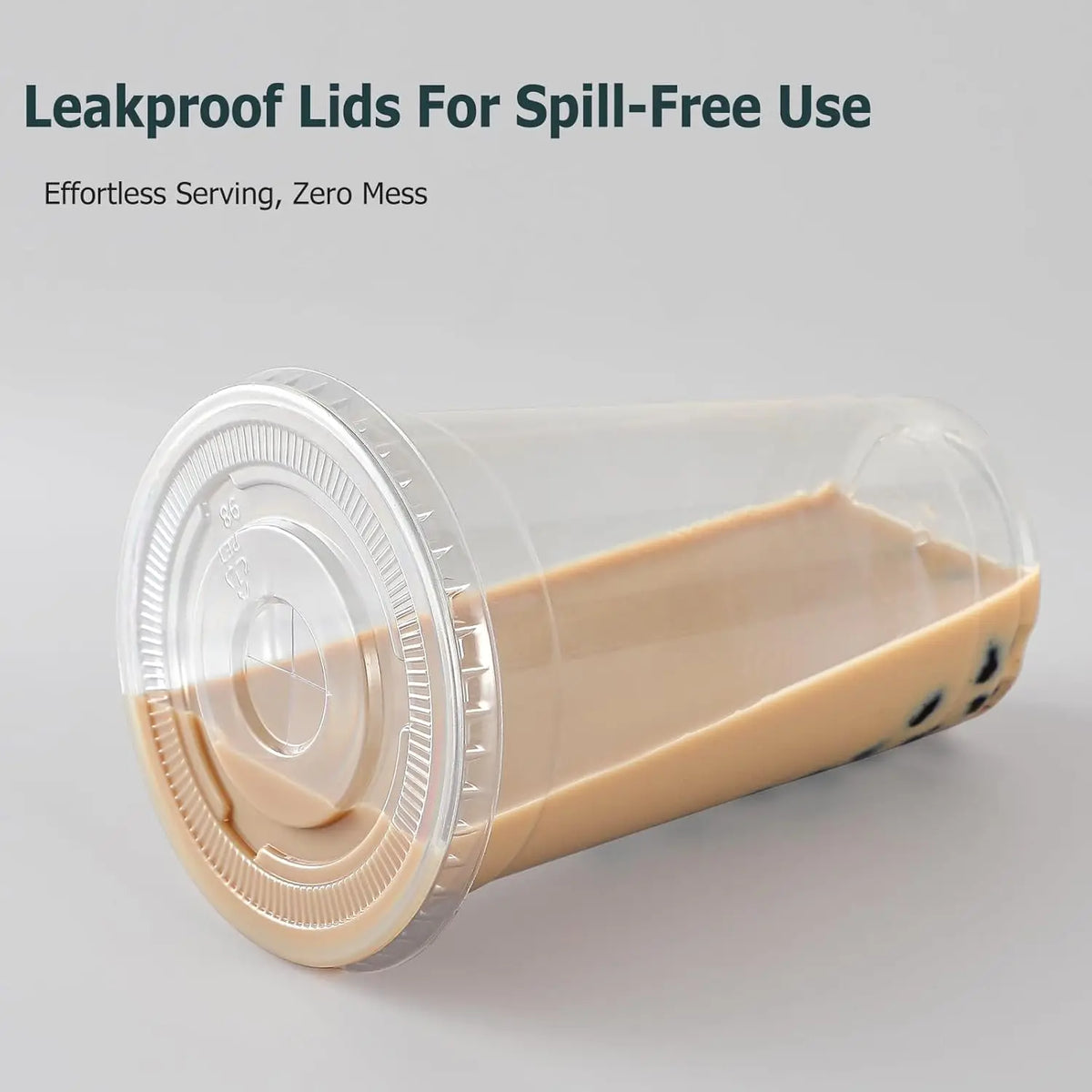 Clear plastic cup with a lid and straw, filled with a light beige liquid.