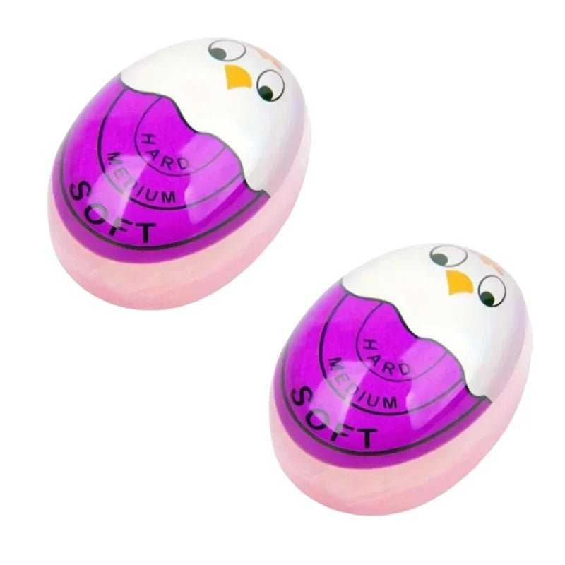 A pink and white color-changing boiled egg timer with purple markings labeled hard and soft.