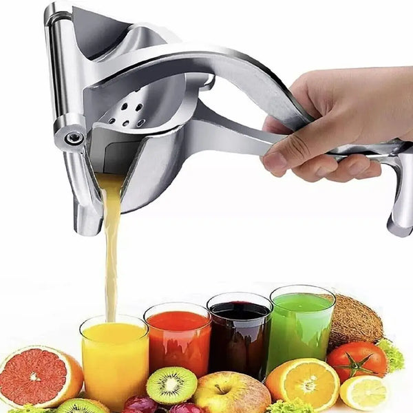 A hand is using a heavy-duty metal citrus juicer to extract juice from a citrus fruit.