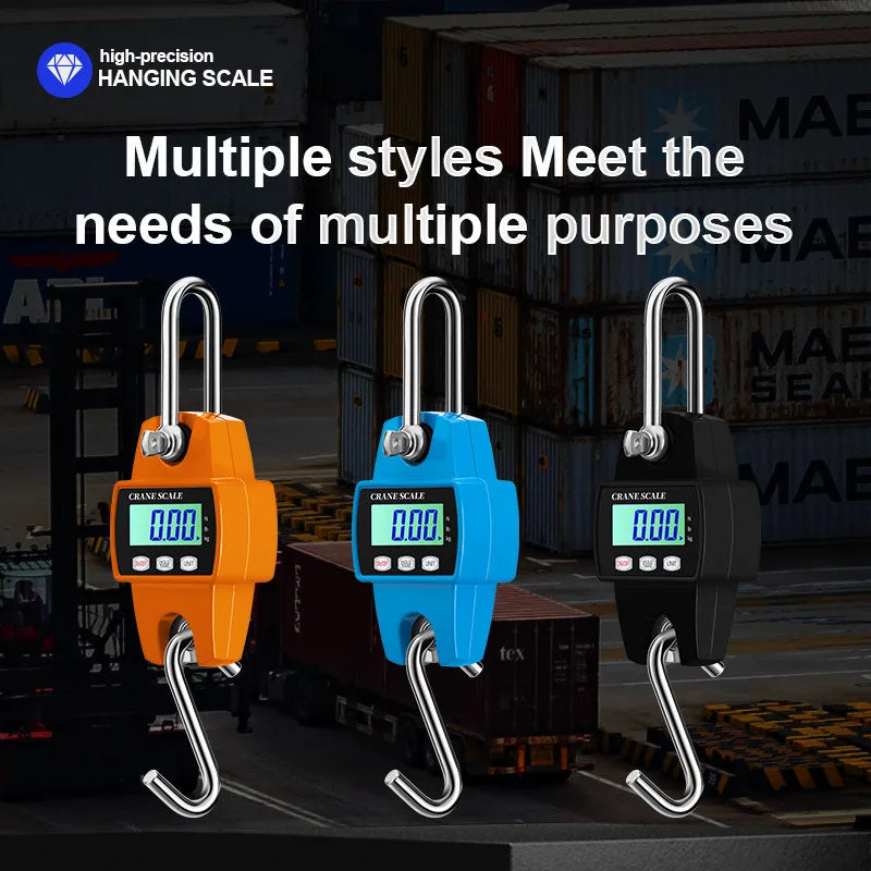 Three orange, blue, and black digital hanging scales are displayed against a dark industrial background.