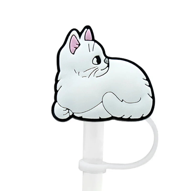 A cute white cat face silicone straw cover attached to a white cup straw.