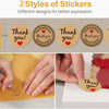 Two styles of thank you stickers on a light brown background for party and celebration supplies