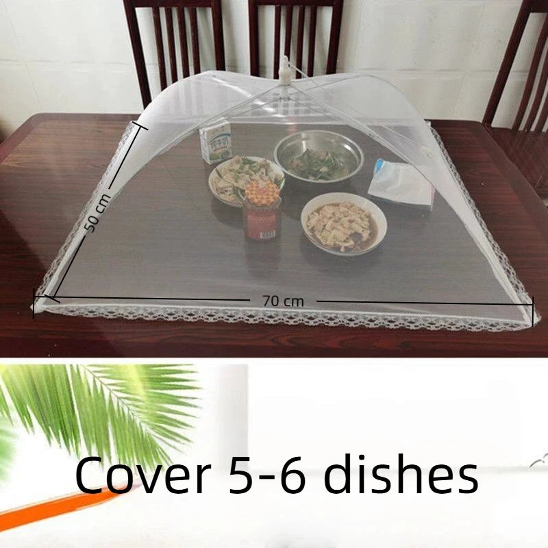 A clear mesh cover is placed over a dark tray containing several small bowls and dishes for food or plant protection.