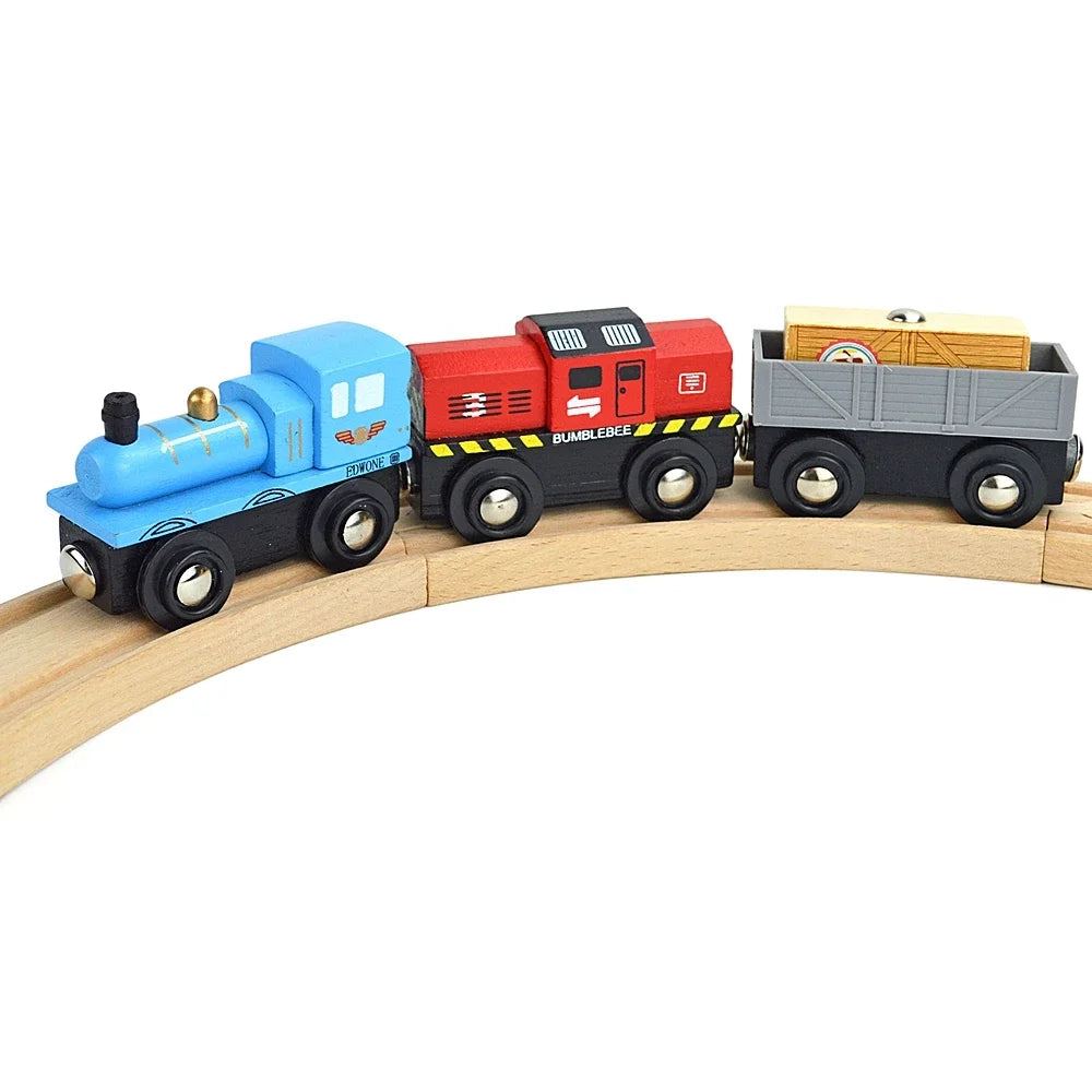 A set of three wooden magnetic Bumblebee train cars in blue, red, and gray.