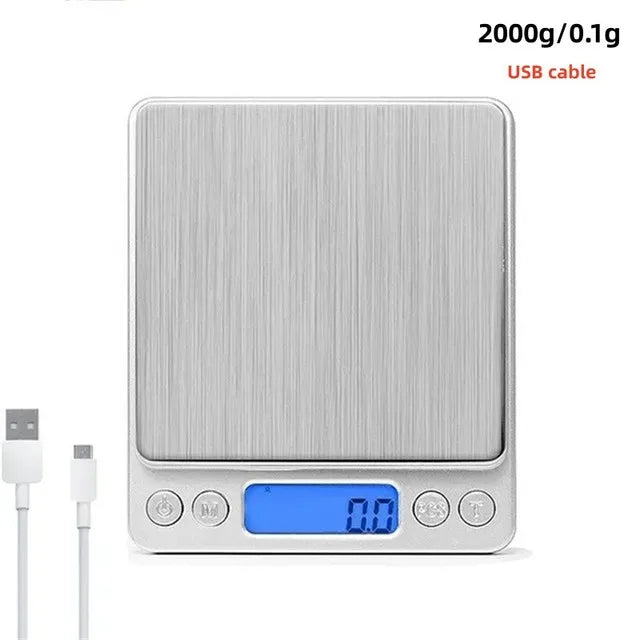 A silver digital kitchen scale with a blue display and USB cable connector.