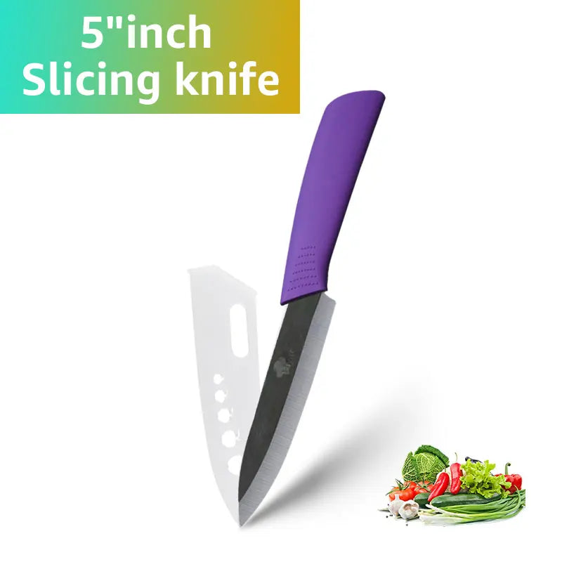 A purple 5-inch slicing knife with a black blade and a white handle is shown next to fresh vegetables.