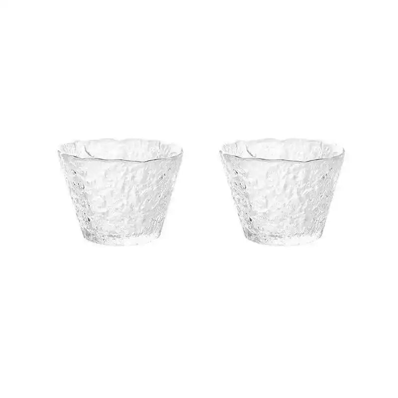 A pair of clear, textured glass tea cups or bowls for a Chinese and Japanese ceremony.