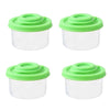 Un set de quatre mini shakers d'épices avec des contenants blancs et des couvercles vert vif.