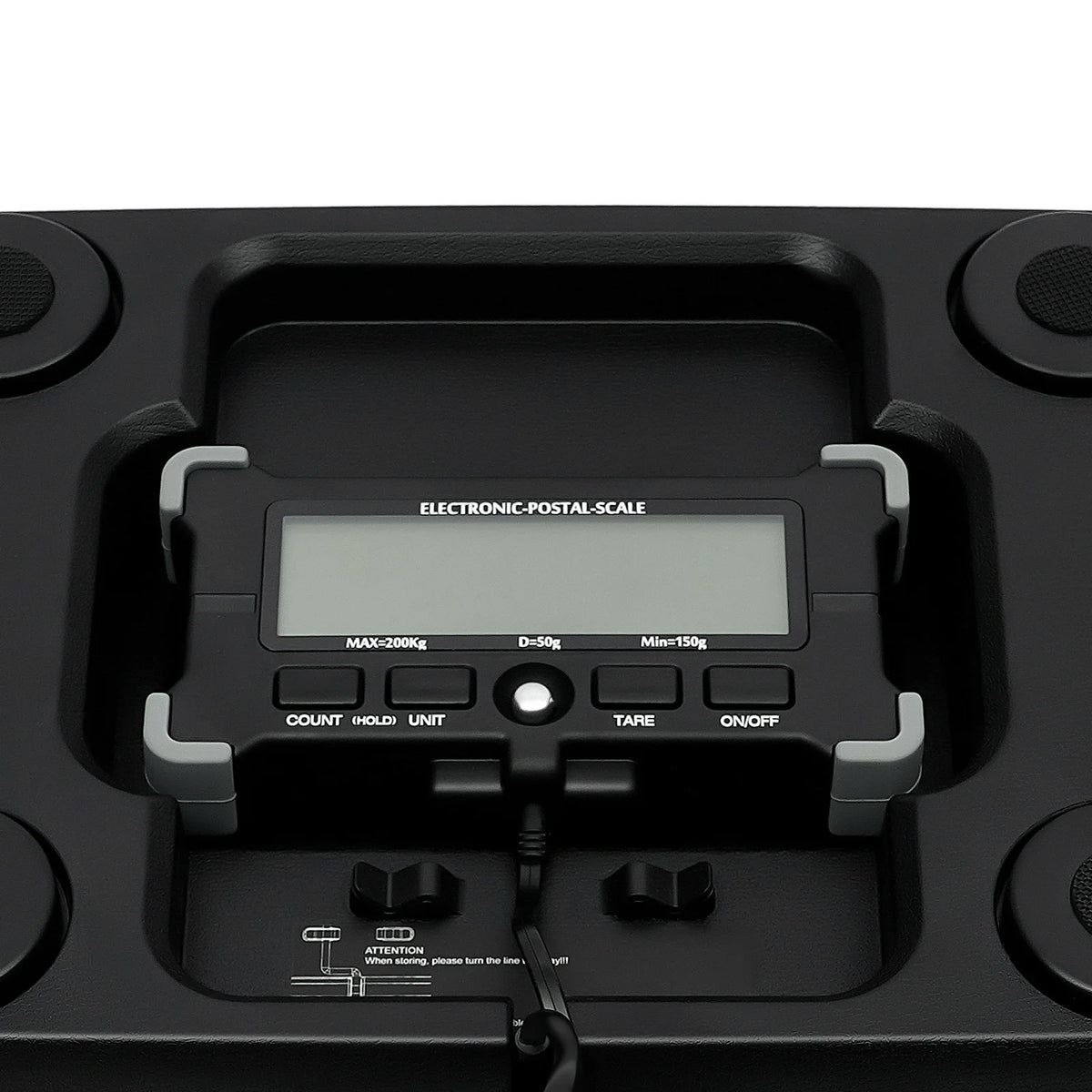 A close-up view of a black electronic postal-scale with digital display and control buttons.