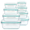 An arrangement of eight clear glass airtight meal prep containers stacked and laid out.