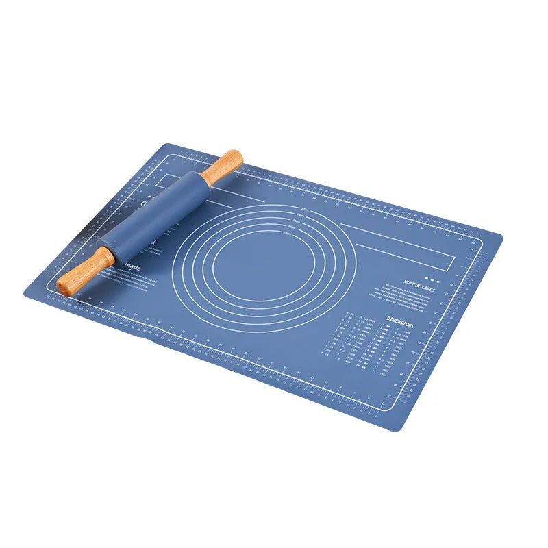 A silicone rolling pin and baking mat set with measurement lines and markings on a blue surface.