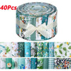 A roll of 40 patchwork cotton fabric strips featuring various floral and nature patterns in shades of green, blue, and white.