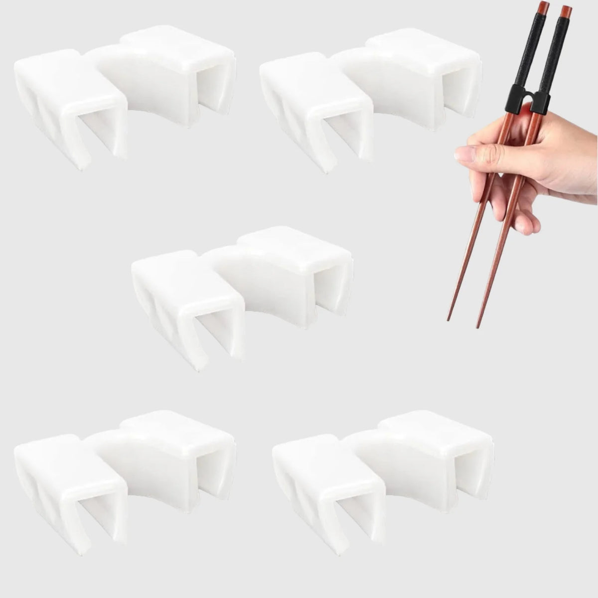 White reusable chopstick helpers and a pair of chopsticks shown in hand