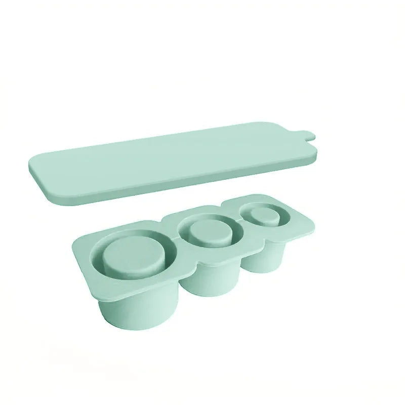 Light green silicone ice cube tray with three cavities for tumblers