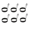 Four black silicone egg rings with metal handles for nonstick cooking