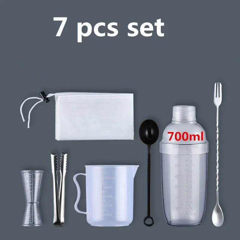 A set of seven plastic cocktail tools including a shaker, strainer, spoon, and measuring cup.