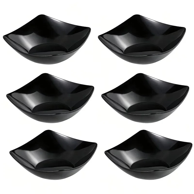 Six black plastic square bowls used for cooking