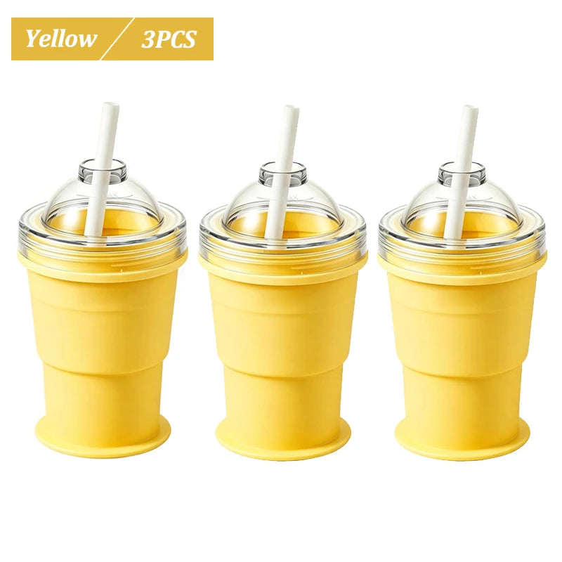 Three yellow reusable silicone ice ball cups with straws