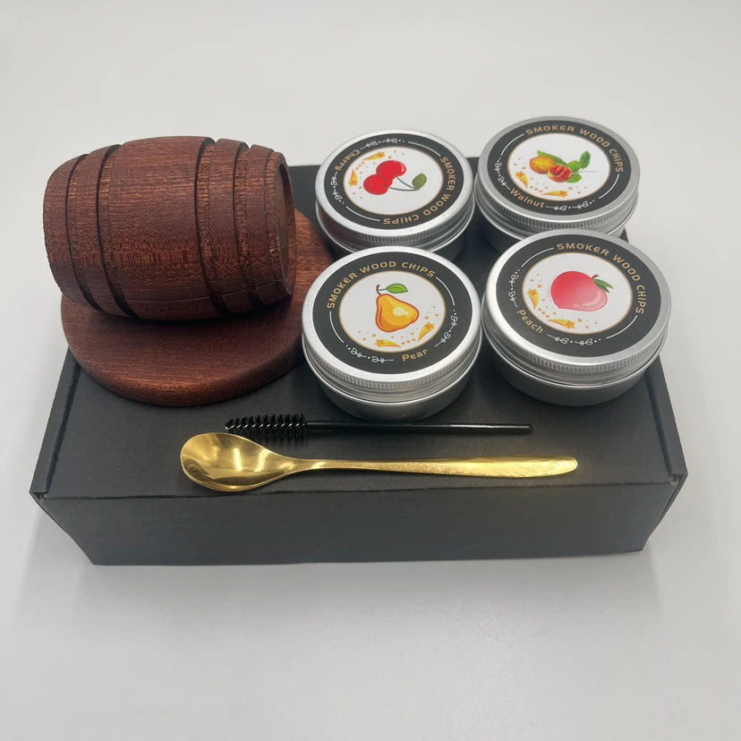A set of six small tins containing whiskey smoker wood chips with various fruit flavors like cherry, lemon, and peach.