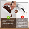 A hand pours coffee beans through a ceramic dosing kit into a white cup, demonstrating a smoother pour than a traditional met