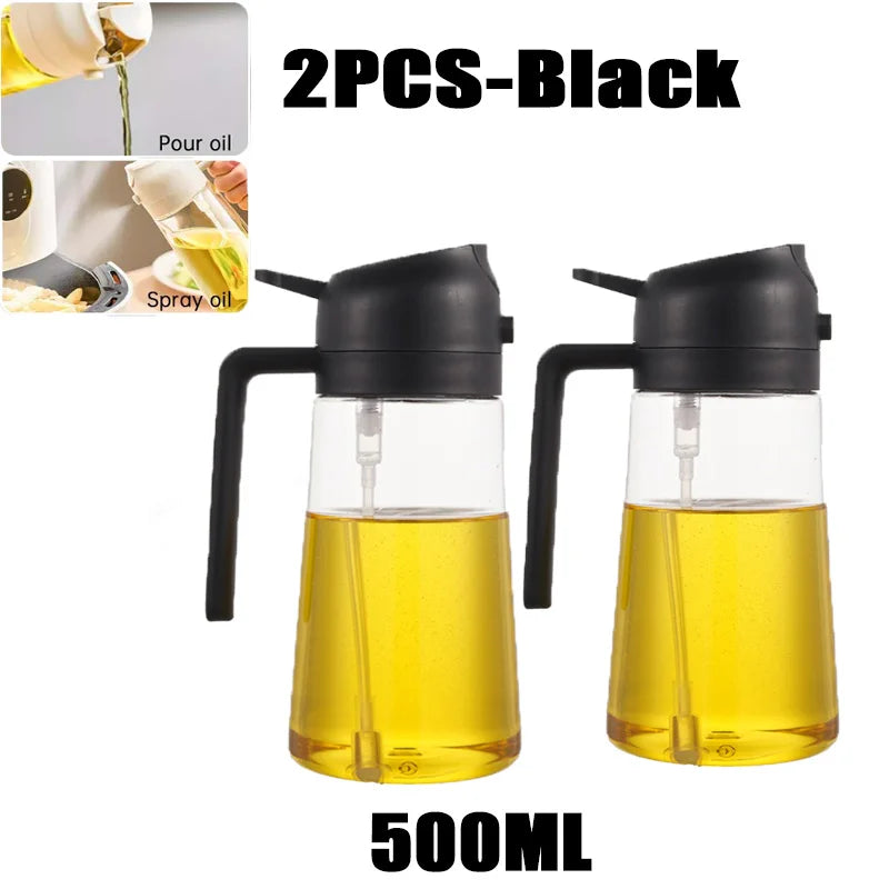 Two 500ml black oil spray bottles with black spouts and clear yellow oil inside
