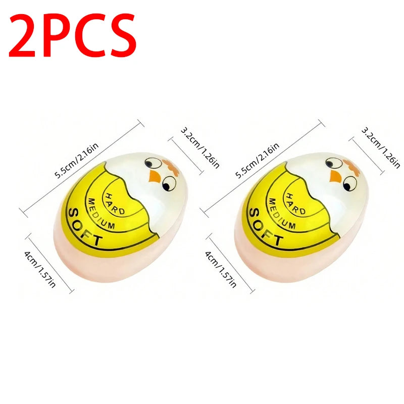 Two yellow and white egg cooking timers are shown, measuring 5.5cm in diameter.