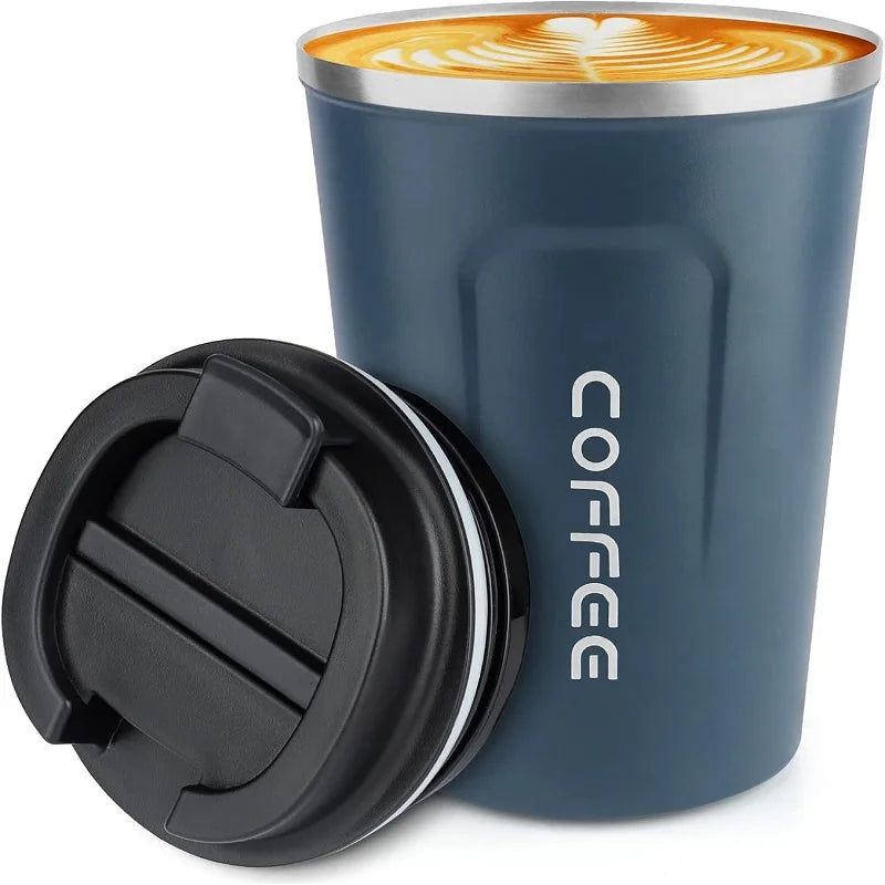 A dark blue double-walled stainless steel travel mug with a black lid and a latte art design on the surface.
