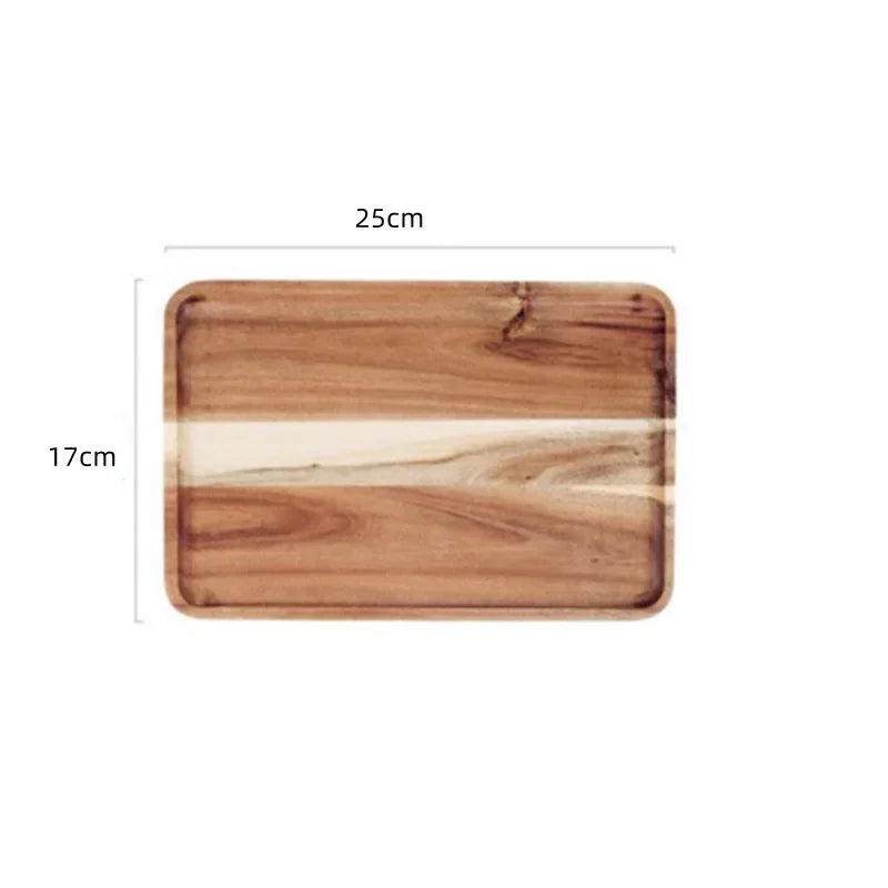 A rectangular serving tray made of natural acacia wood with light grain visible.