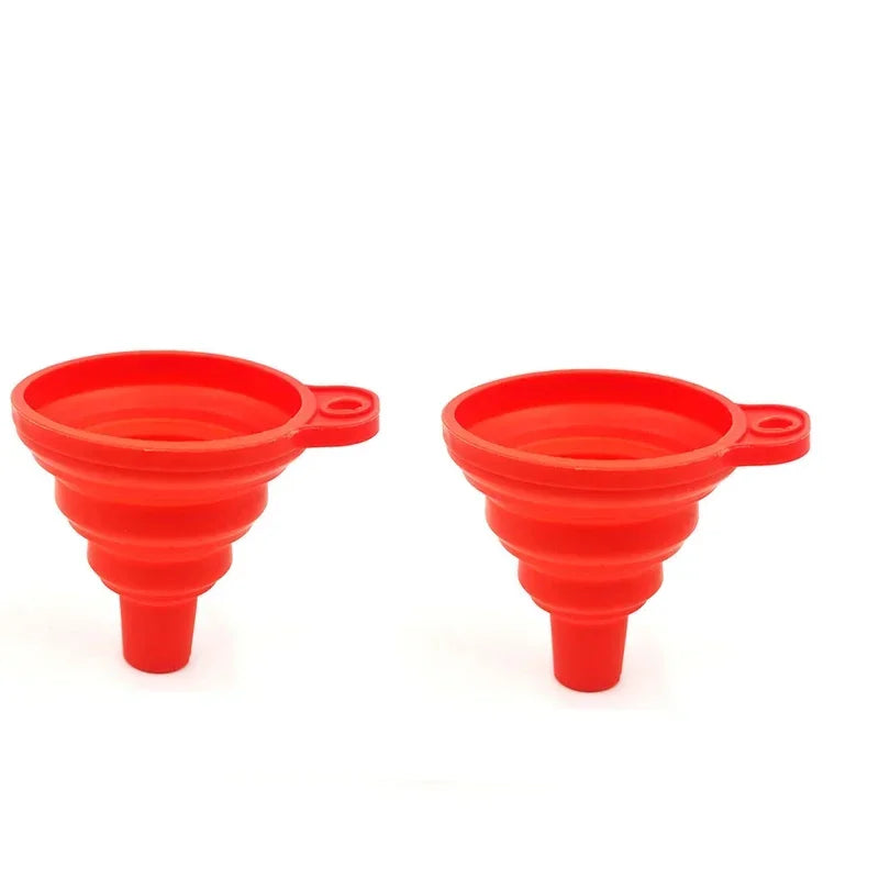 A pair of bright red silicone collapsible funnels for kitchen use.