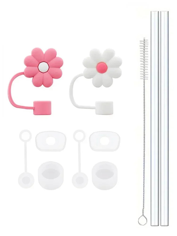 A set of reusable silicone straw covers and cleaning brushes with pink and white floral designs.