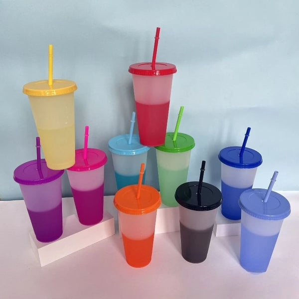 A collection of ten colorful reusable plastic tumblers in various shades including yellow, pink, green, blue, and purple.