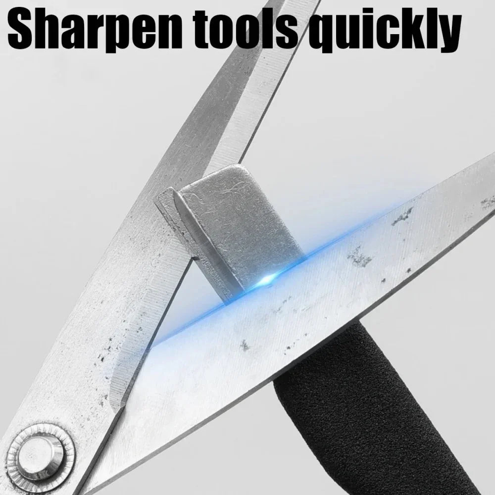 A close-up of a metal knife sharpener being used to sharpen a blade with a bright blue light.