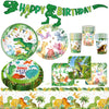 A set of dinosaur theme disposable party decor including a banner, plates, cups, and food wrappers.