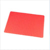 A rectangular silicone BBQ pizza mat or baking liner in bright coral pink.