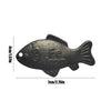 A black reusable iron fish kitchen accessory with dimensions 4cm x 1.57in and 7cm x 2.75in.