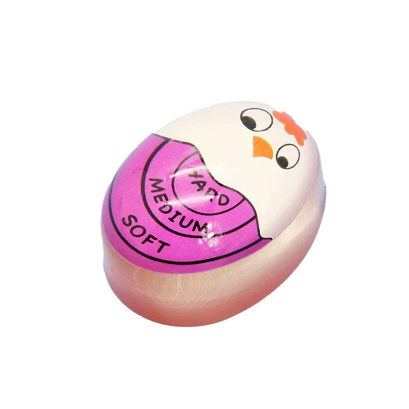A pink and white color-changing boiled egg timer with a cartoon face design.